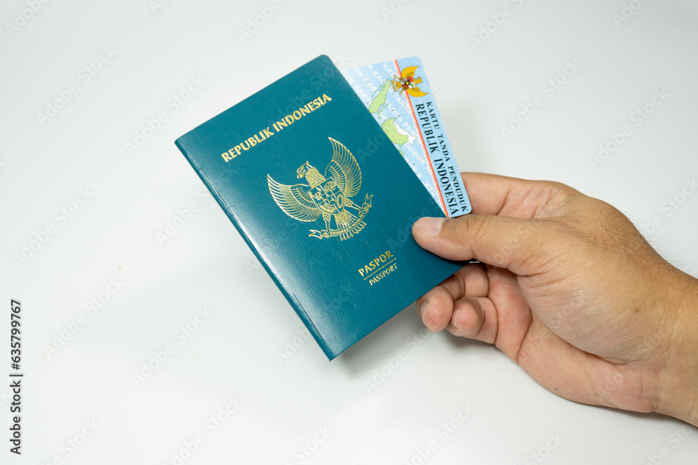 Fototapeta premium hand holding passport and ID Card