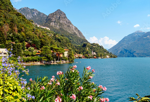 Italy, Lake Lugano. View of the lake, mountains, houses standing above the lake.