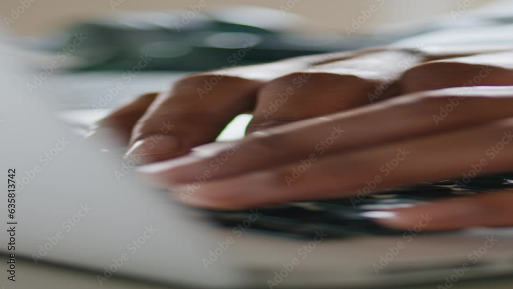 Guy hands typing keyboard laptop vertically closeup. Man arms pressing buttons Guy hands typing keyboard laptop vertically closeup. Man arms pressing buttons