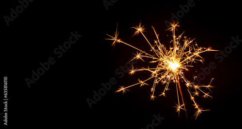 Sparks lit at Christmas and New Year party on black background.