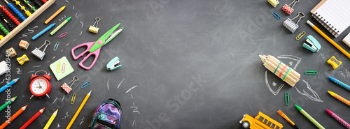 Back to school concept. rocket and pencils over classroom blackboard. Top view