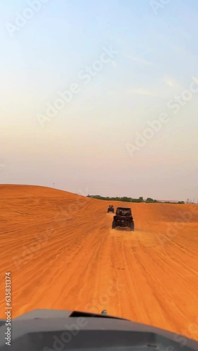Riding buggies in the desert during sunset. High quality FullHD footage