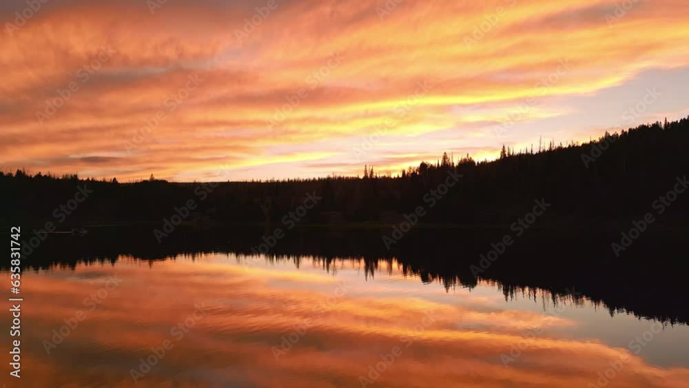 Flying over lake reflecting colorful sunset in the wilderness of Utah. Flying over lake reflecting colorful sunset in the wilderness of Utah.