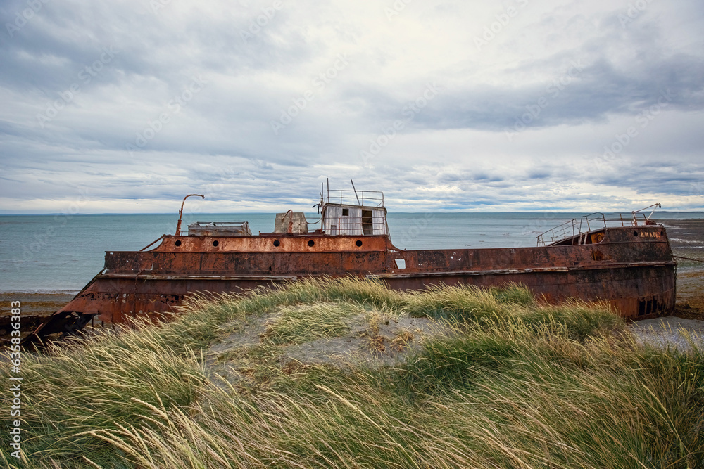 Shipwreck called Amadeo on the  coast of Magellan Strait, rusty warship wreck, Tierra Del Fuego, Chile