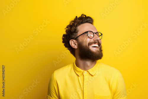 Happy European Man On Yellow Background photo
