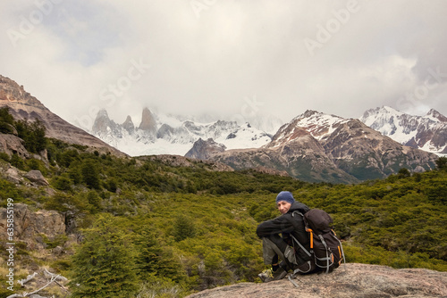 Beautiful nature of Patagonia. Man with a backpack observing the view at Fitz Roy trek  view of Andes mountains  Los Glaciers National Park  El Chalten  Argentina