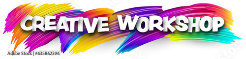 Creative workshop paper word sign with colorful spectrum paint brush strokes over white.