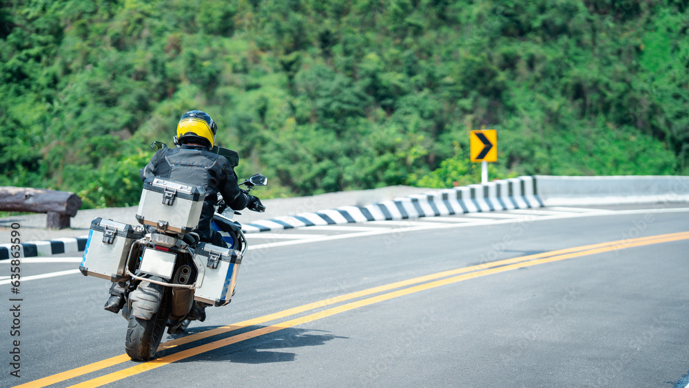 motorcycle on the road rides away. Travel on vacation, enjoy the nature trail. motorcycle in a sunny motorbike on the road riding.with sunset light. copyspace for your individual text. motorcycle on the road rides away. Travel on vacation, enjoy the nature trail. motorcycle in a sunny motorbike on the road riding.with sunset light. copyspace for your individual text.