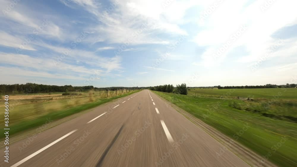 POV Driving over dyke near Amerongen in the Netherlands. Floodplains and farmland on both sides POV Driving over dyke near Amerongen in the Netherlands. Floodplains and farmland on both sides