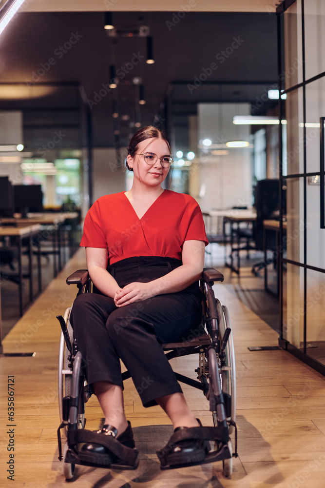 A modern young businesswoman in a wheelchair is surrounded by an inclusive workspace with glass-walled offices, embodying determination and innovation in the business world