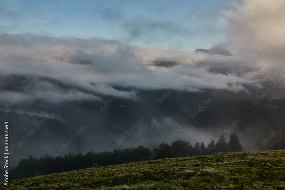 The fog over the Col de la Hourcère from where you can see great peaks of the Pyrenees such as Pic d'Anie, in the French Pyrenees region The fog over the Col de la Hourcère from where you can see great peaks of the Pyrenees such as Pic d'Anie, in the French Pyrenees region