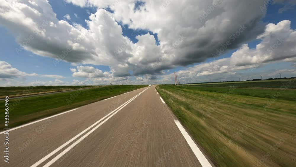 POV driving on oblique bend in the road in the flevopolder in the netherlands POV driving on oblique bend in the road in the flevopolder in the netherlands