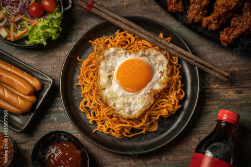 Korean instant noodles and a fried egg on top and Korean fried chicken in Korean spicy sauce, Ancient food