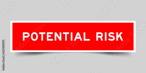 Sticker label with word potential risk in red color on gray background