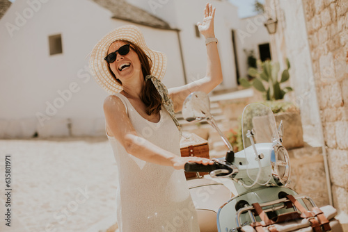 A young woman in a white dr...