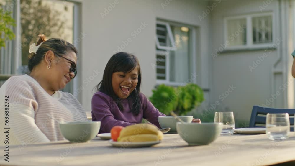 Happy loving Multi-ethnic asian family having breakfast in the garden Happy loving Multi-ethnic asian family having breakfast in the garden