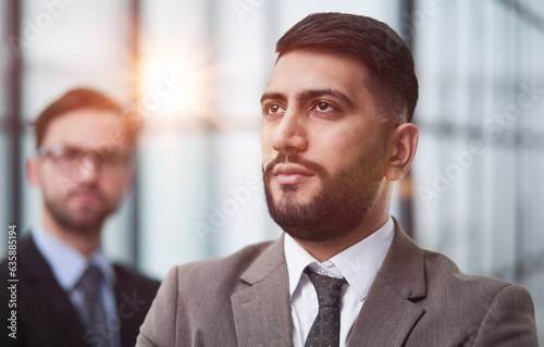 Portrait male worker looking at camera, positive employee posing for company business directory with co-workers