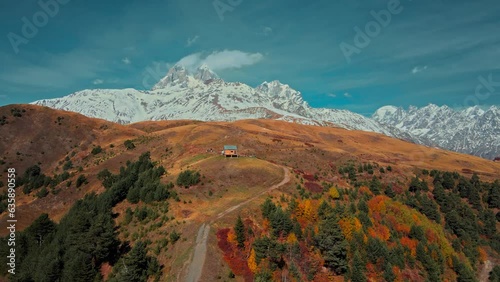 Aerial view of Amazing view from the Tskahazagari peak on the Svaneti mountain peaks in the Greater Caucasus Mountain Range, Upper Svaneti, Georgia autumn, Cottage, hut photo
