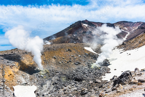 Active volcano Asahidake with fumaroles emitting sulphuric gases in Hokkaido
