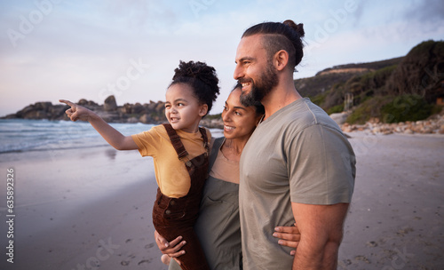 Child, pointing and happy family on beach at sunset on summer, vacation or bonding together on tropical holiday in Costa Rica. Ocean, view and interracial parents support girl or kid show with hand