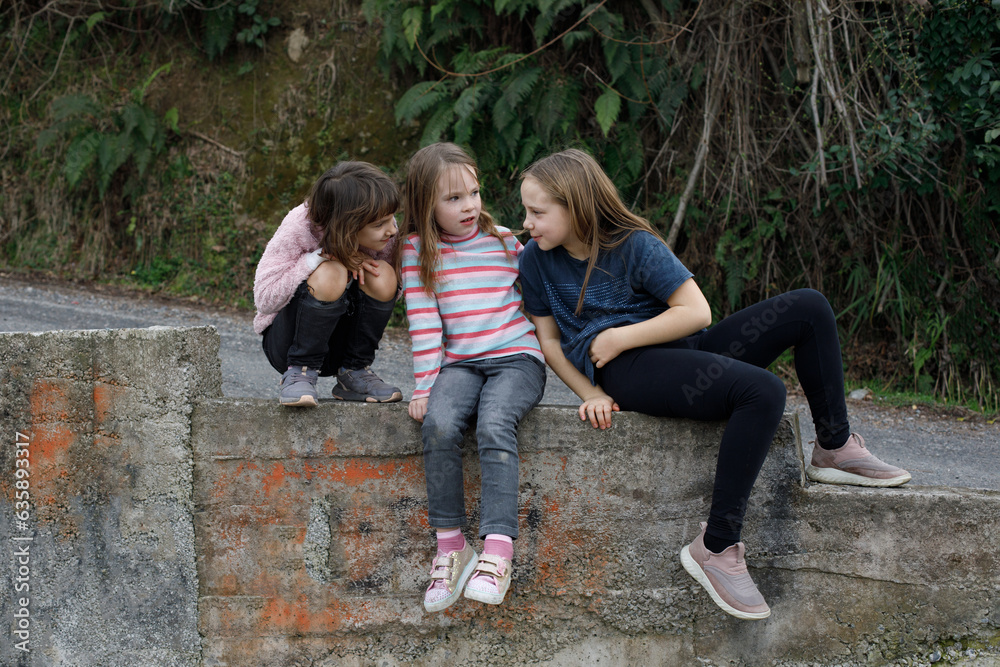 Cute kids chatting and playing together outdoor