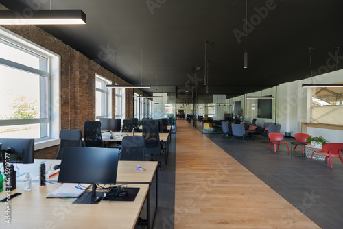 In a setting of modern, glass-walled business startup offices, the open, airy workspace reflects a contemporary and innovative ambiance, promising a dynamic environment for entrepreneurial growth