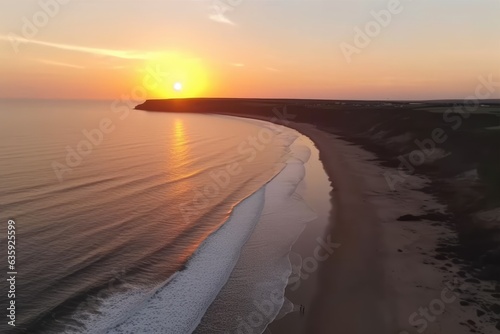 Aerial shot of a sunset over the sea. Lovely sea waves. Pink beach and a magnificent sea. A seascape at sunset in the summer. Sunsets on the Atlantic Ocean beach. The texture of water. A birds eye