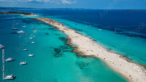 Aerial of the white sand beach of Platja de Ses Illetes, Formentera, Balearic Islands, Spain, Mediterranean photo
