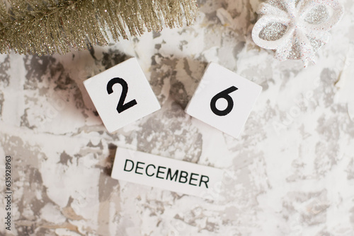 Flatlay, Christmas decoration and wooden calendar with date December 26 on light background, Boxing Day. Concept of preparing for the celebration of Christmas and New Year and plans for the future.