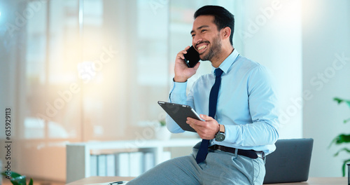 Business man talking on a phone while browsing on a digital tablet in an office. Dedicated sales executive and young expert communicating project plans and discussing deals with clients in a company photo