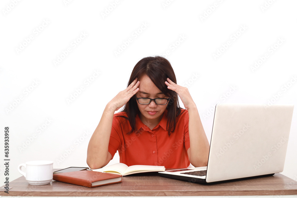 Frustrated young asian entrepreneur woman sitting while holding her head. Isolated on white Frustrated young asian entrepreneur woman sitting while holding her head. Isolated on white
