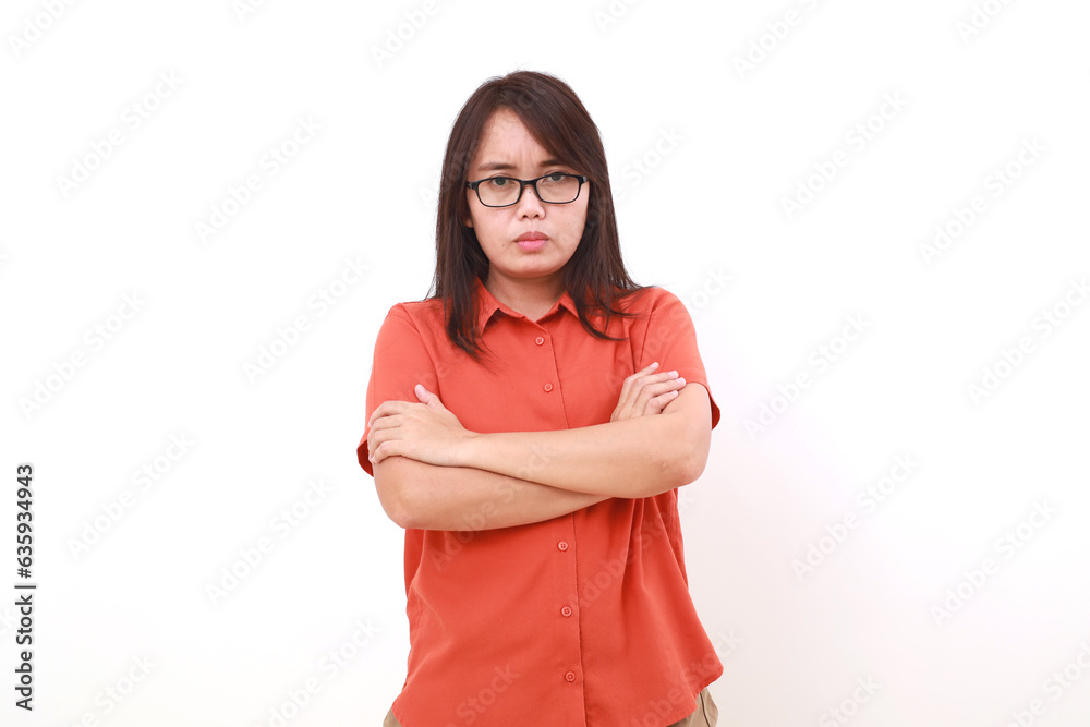 Serious young asian woman looking at the camera with folded hands. Isolated on white Serious young asian woman looking at the camera with folded hands. Isolated on white