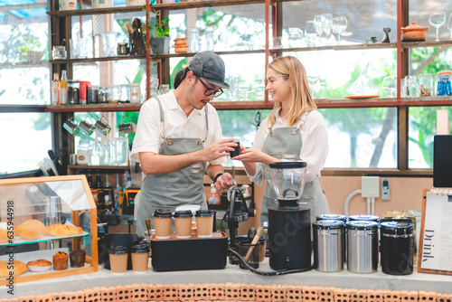 Barista at a coffee shop pr...