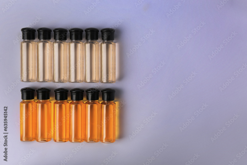 Bottles of cosmetic products on white background, flat lay. Space for text