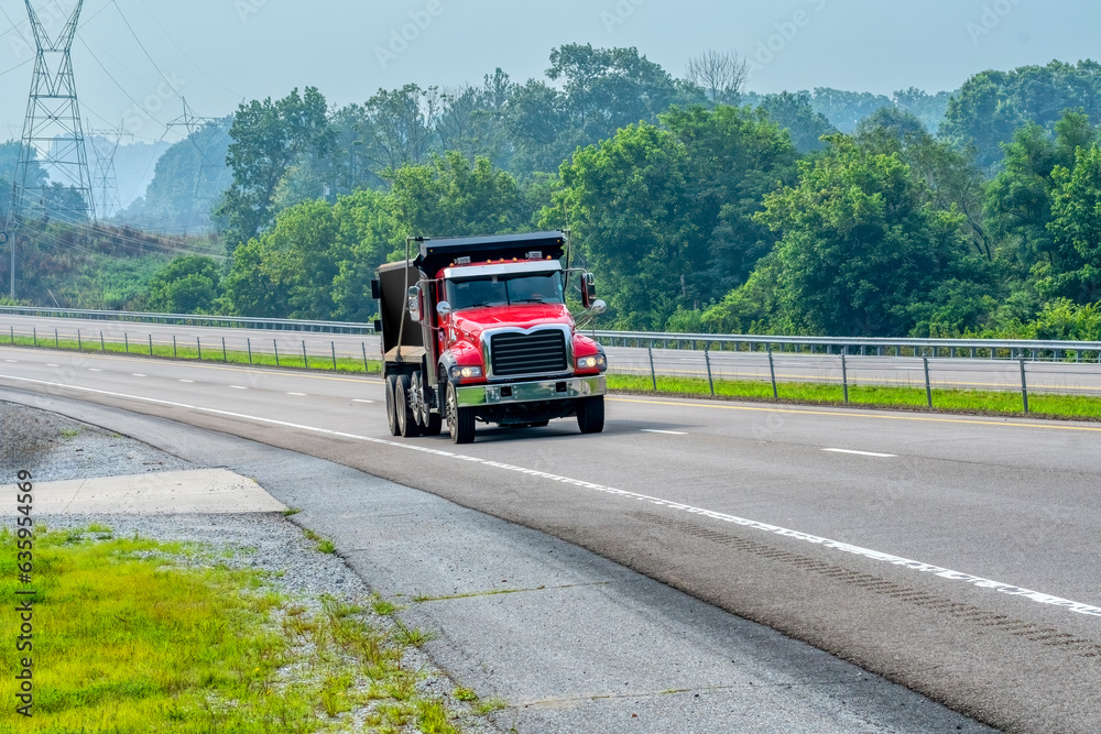 Red Dump Truck On Access Road