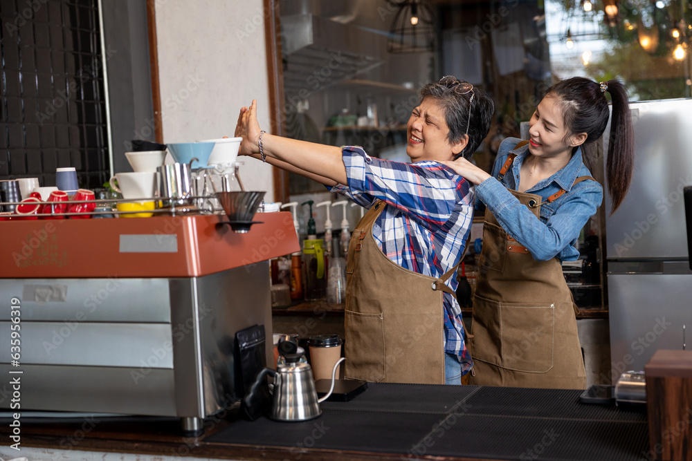 A woman takes care of her mother after receiving a big order. with a relaxing massage on the shoulder
senior woman with arms extended To relax muscles, relax
Wellness takes care of seniors