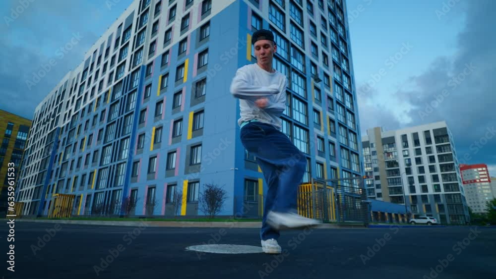 Active Pastime On City Street Of Youth In Evening, Young Talented Man Dancing Hip-Hop And Breakdance Active Pastime On City Street Of Youth In Evening, Young Talented Man Dancing Hip-Hop And Breakdance