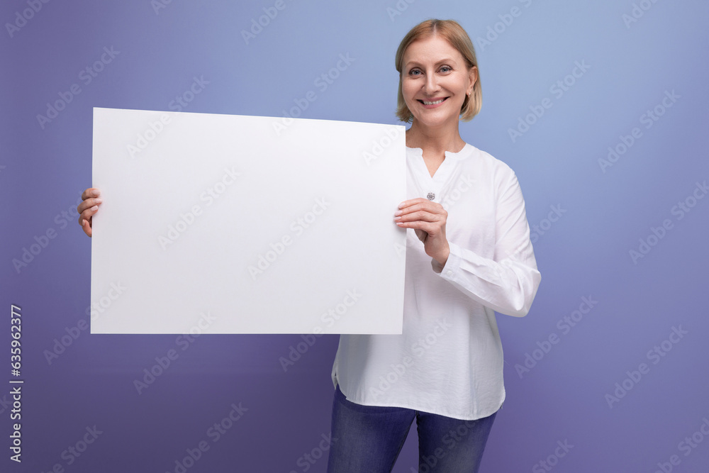 middle aged woman holding blank white paper for news with mocup middle aged woman holding blank white paper for news with mocup