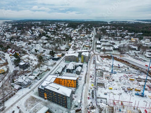 a snowy city with a large road going through the center photo