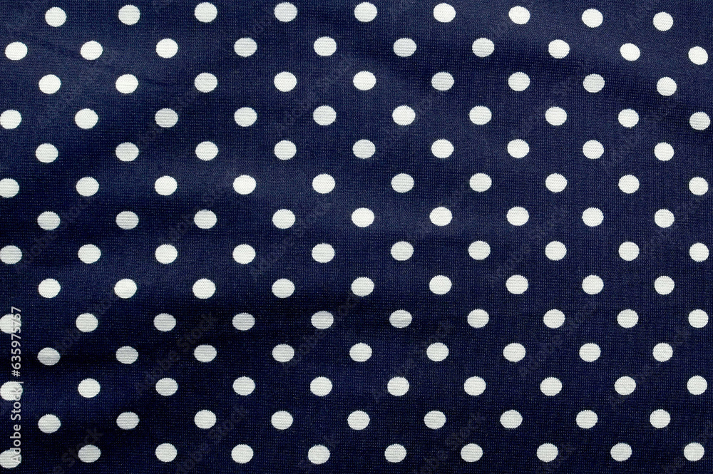 Blue fabric design with small white circles, space for text