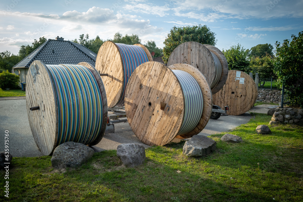much large reels with fiber optic cables stand on a square much large reels with fiber optic cables stand on a square
