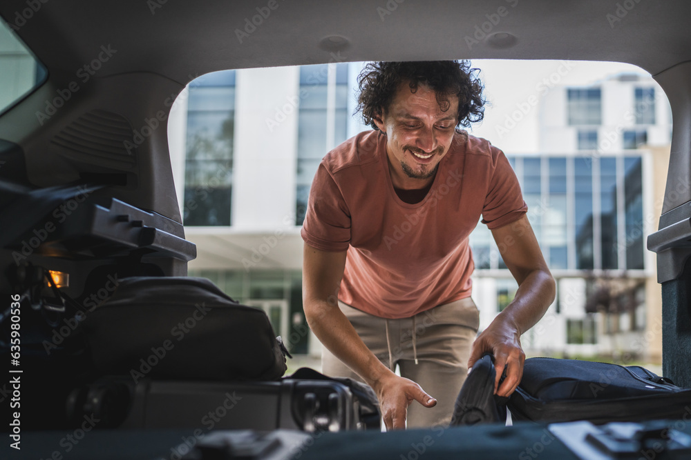 one man travel take stuff belongings from or pack to the back of car one man travel take stuff belongings from or pack to the back of car