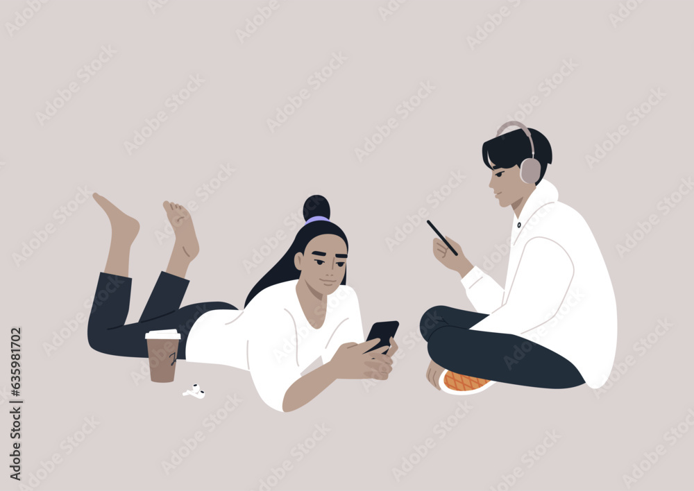 Two adolescents engrossed in their electronic devices, their interaction transitioning from the physical world to the virtual realm of online social media Two adolescents engrossed in their electronic devices, their interaction transitioning from the physical world to the virtual realm of online social media