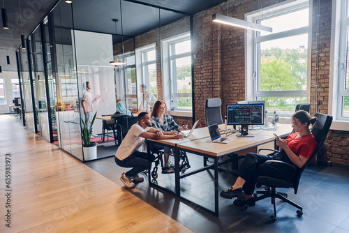 Fotografie A diverse group of business professionals collaborates in a modern startup cowor