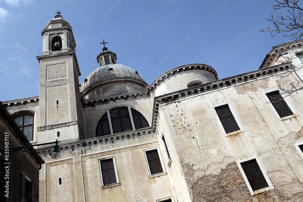 Church front, square and traditional venetian appartment buildings - Venice - Italy