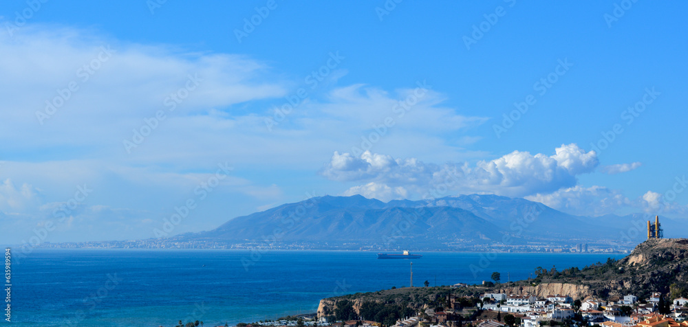 Panoramic mountain and sea views in Malaga, Andalusia, Spain. Blue sky with clouds. Beautiful summer landscape.