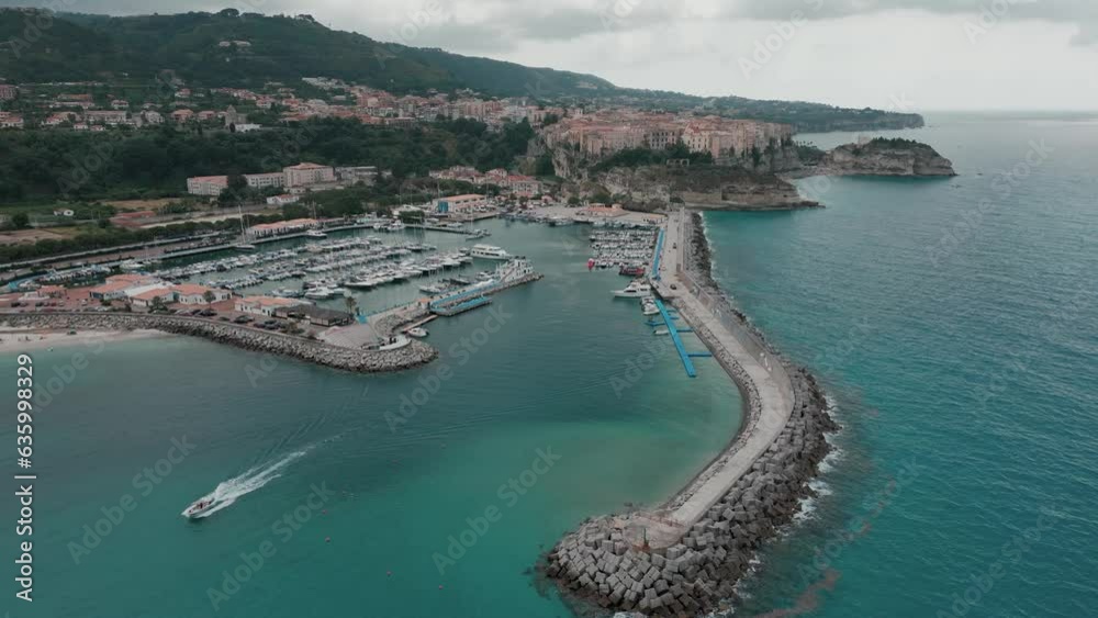 Drone shot over the shore of Tropea Beach and Tonnara di Palmi on a cloudy day Drone shot over the shore of Tropea Beach and Tonnara di Palmi on a cloudy day