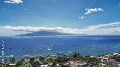 Lahaina from above, in west Maui, Hawaii. With the island of Lanai in the background. Aerial drone image shot April 11, 2023. The village of Lahaina burned down four months later, on August 8, 2023.