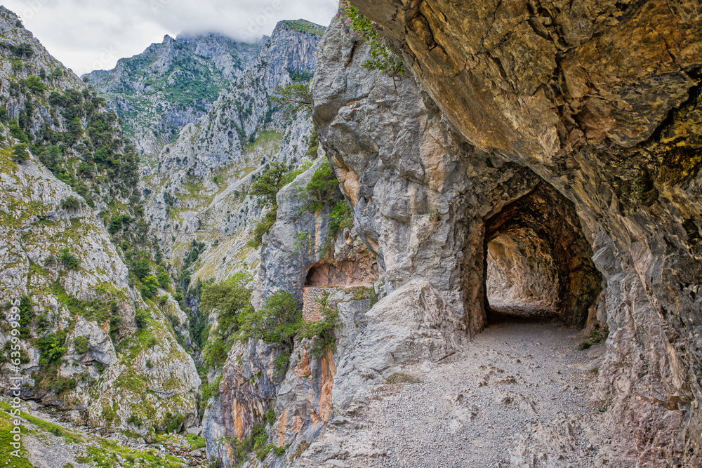 The Narrow Hiking Trail Winding Along The Rock Face In The Ruta Del