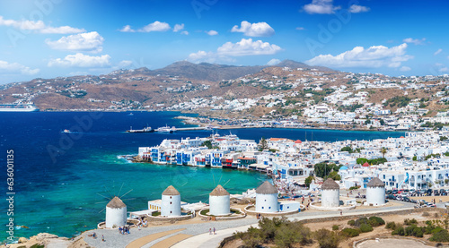 Aerial view through the famous windmills above Mykonos town, Cyclades, Greece, to the Little Venice district during summer time photo